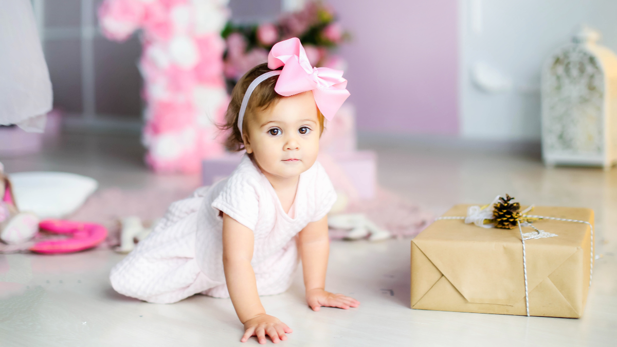 Toddler crawling towards present