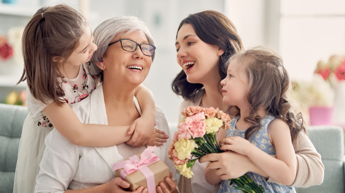 Grandmother, Mother and 2 daughters all smiling