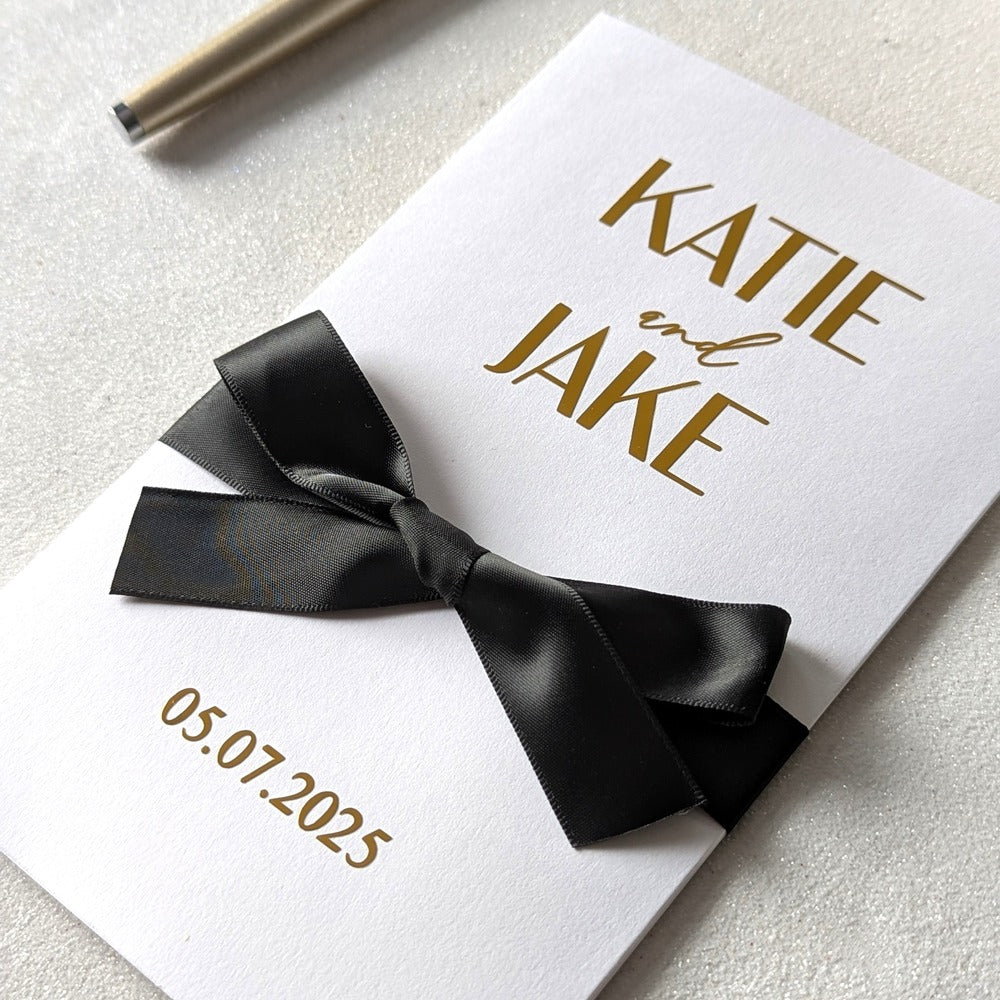 Elegant wedding cash envelope with Katie and Jake and wedding date in gold foil with black ribbon