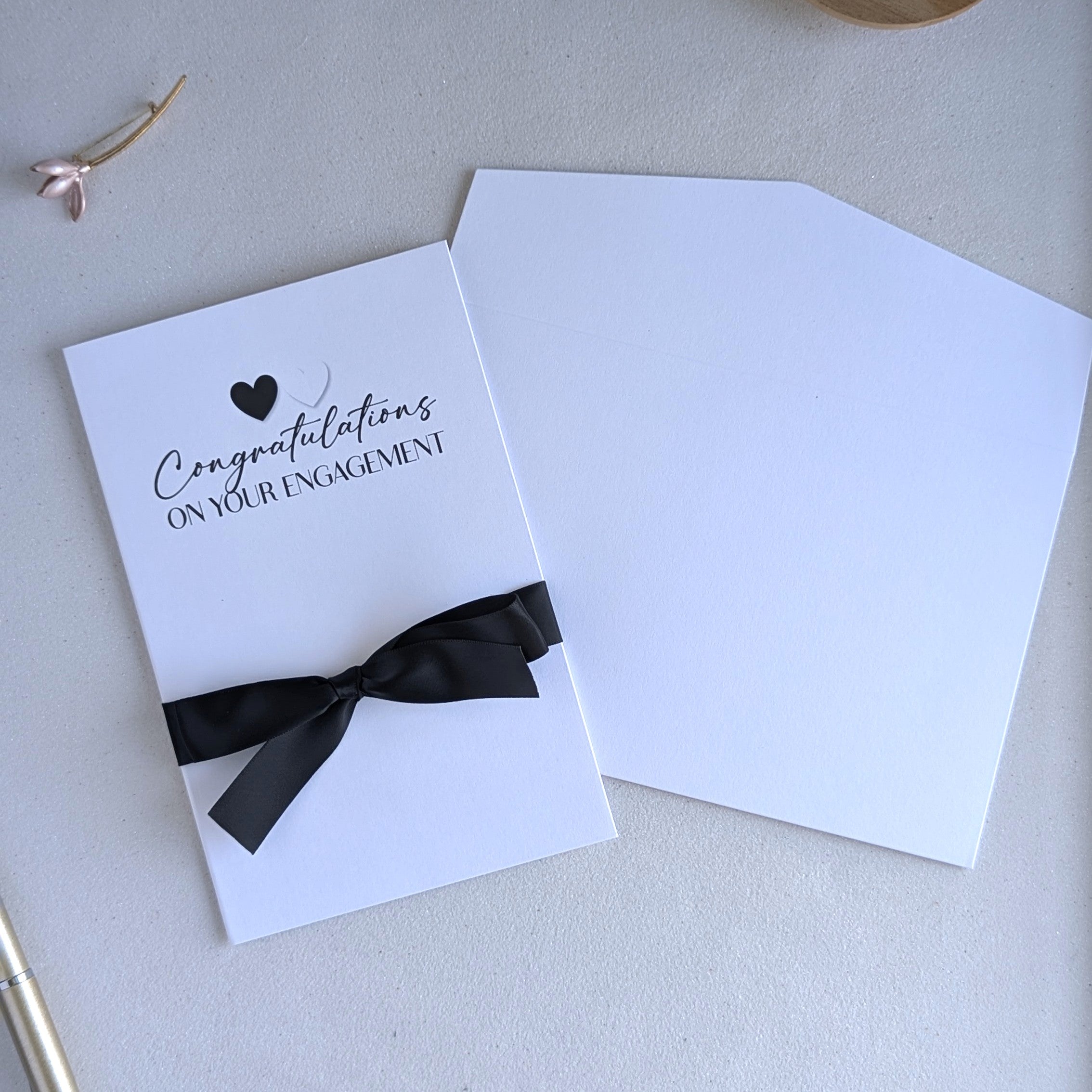 Congratulations on your engagement greeting card printed in black and white with black satin ribbon with black and white hearts and matching envelope