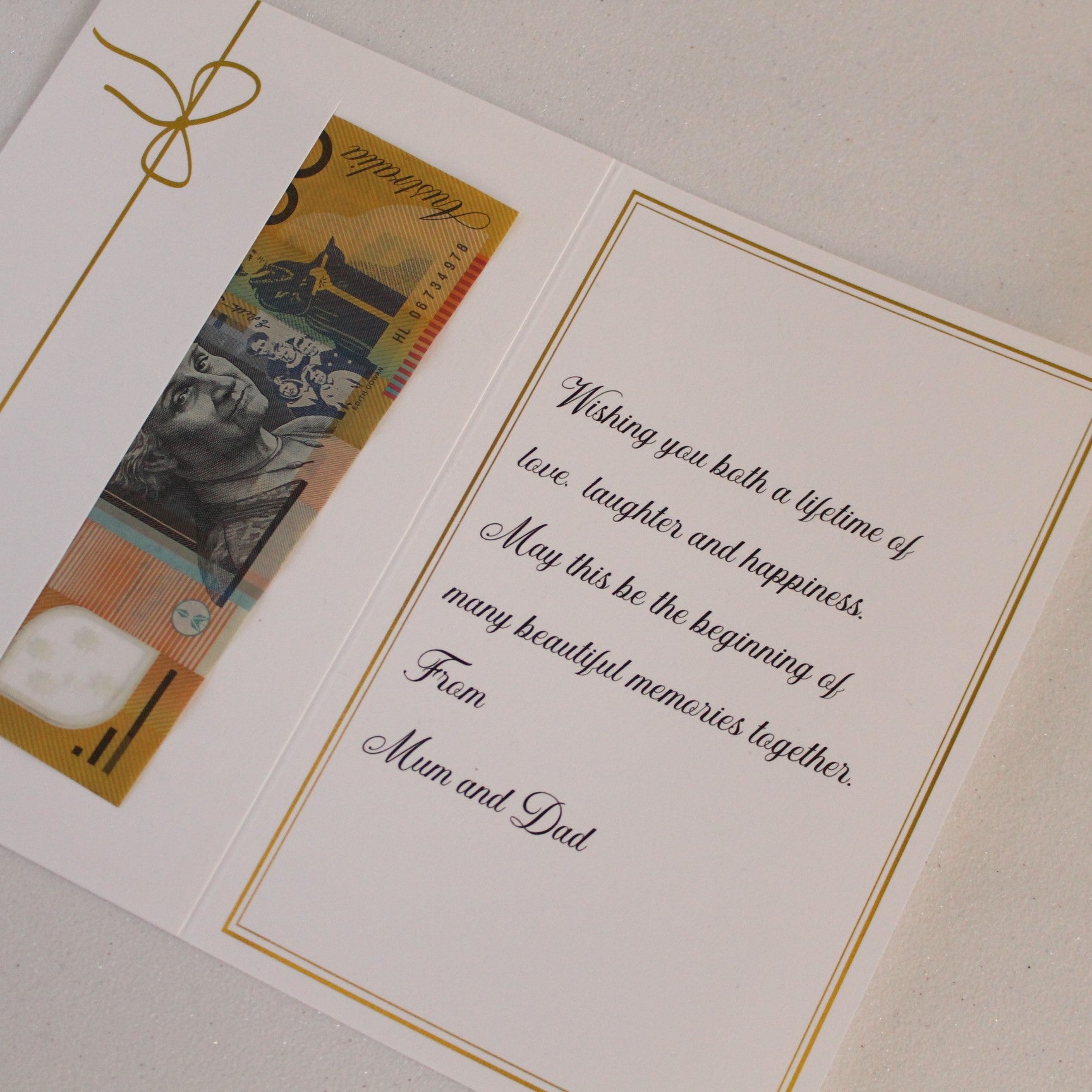 Close up of wedding money envelope with money in the pocket and personalised message printed in the card.