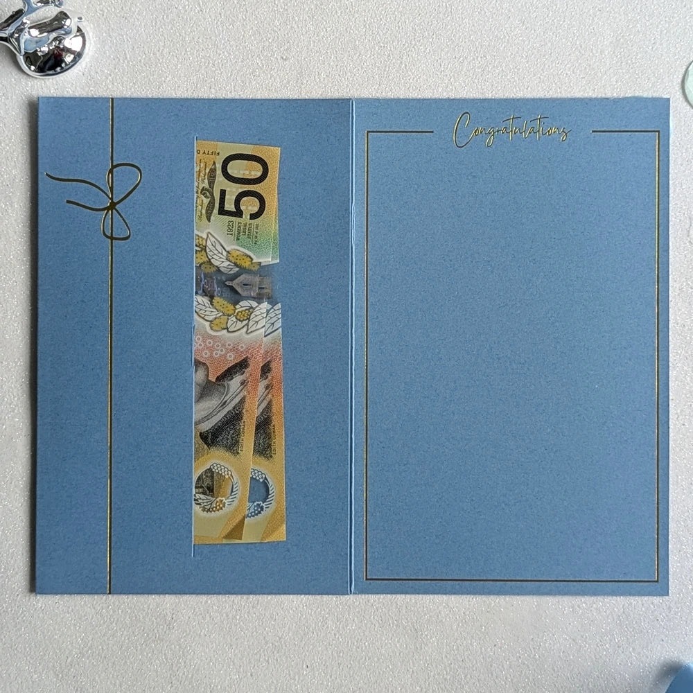 Personalised Christening day money envelope in blue with money in the gift pocket