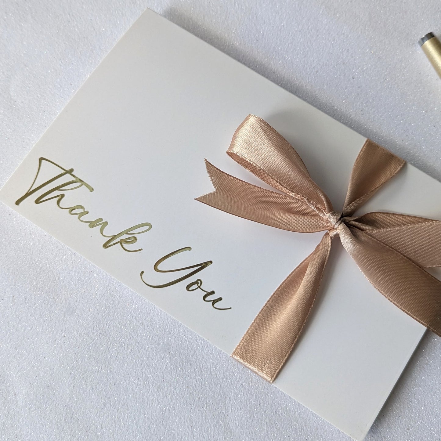 Beautiful Thank you gift envelope with gold ribbon close up