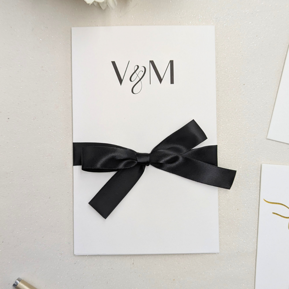Close up of Wedding money gift card envelope with black satin ribbon
