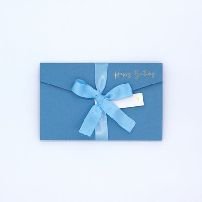 Blue happy birthday pocket greeting card with blue ribbon and white name tag. Blue luxury birthday money wallet for 18th, 21st, 30th, 40th, 50th, 60th, 70th, 80th, 90th, 100th