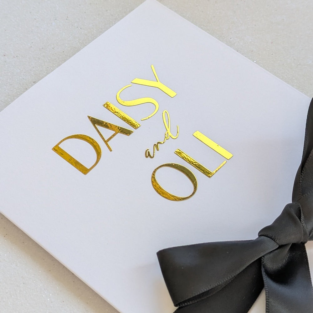 Personalised Luxury Wedding Money Envelope with daisy and oli personalised on the front of the card with black ribbon