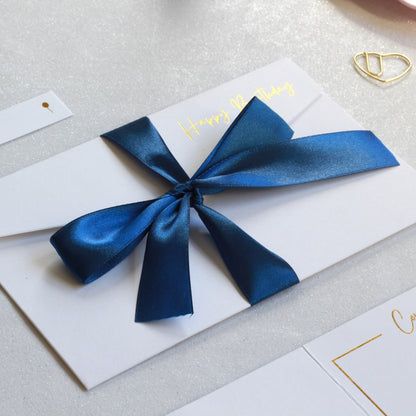 Dark Blue ribbon on white greeting card with money pocket