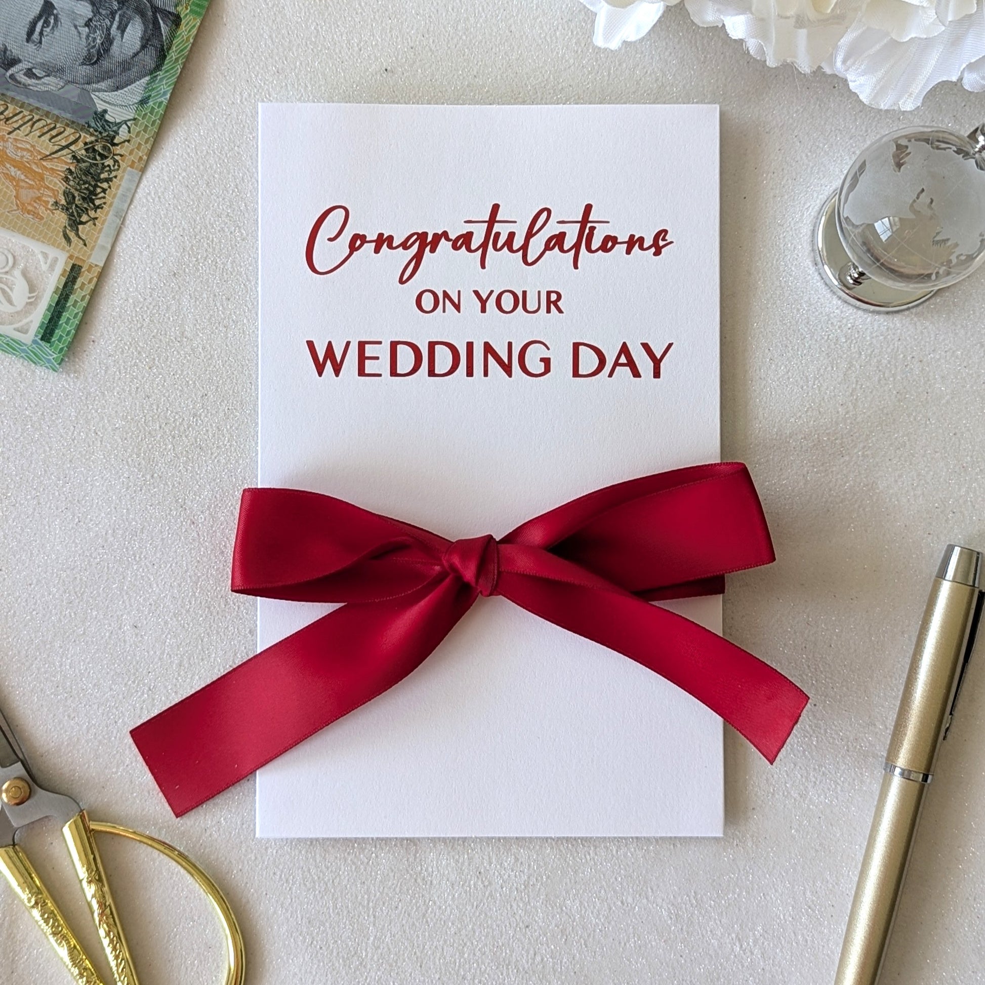 Chinese money envelope for wedding, hongbao, with red congratulations on your wedding day and red ribbon