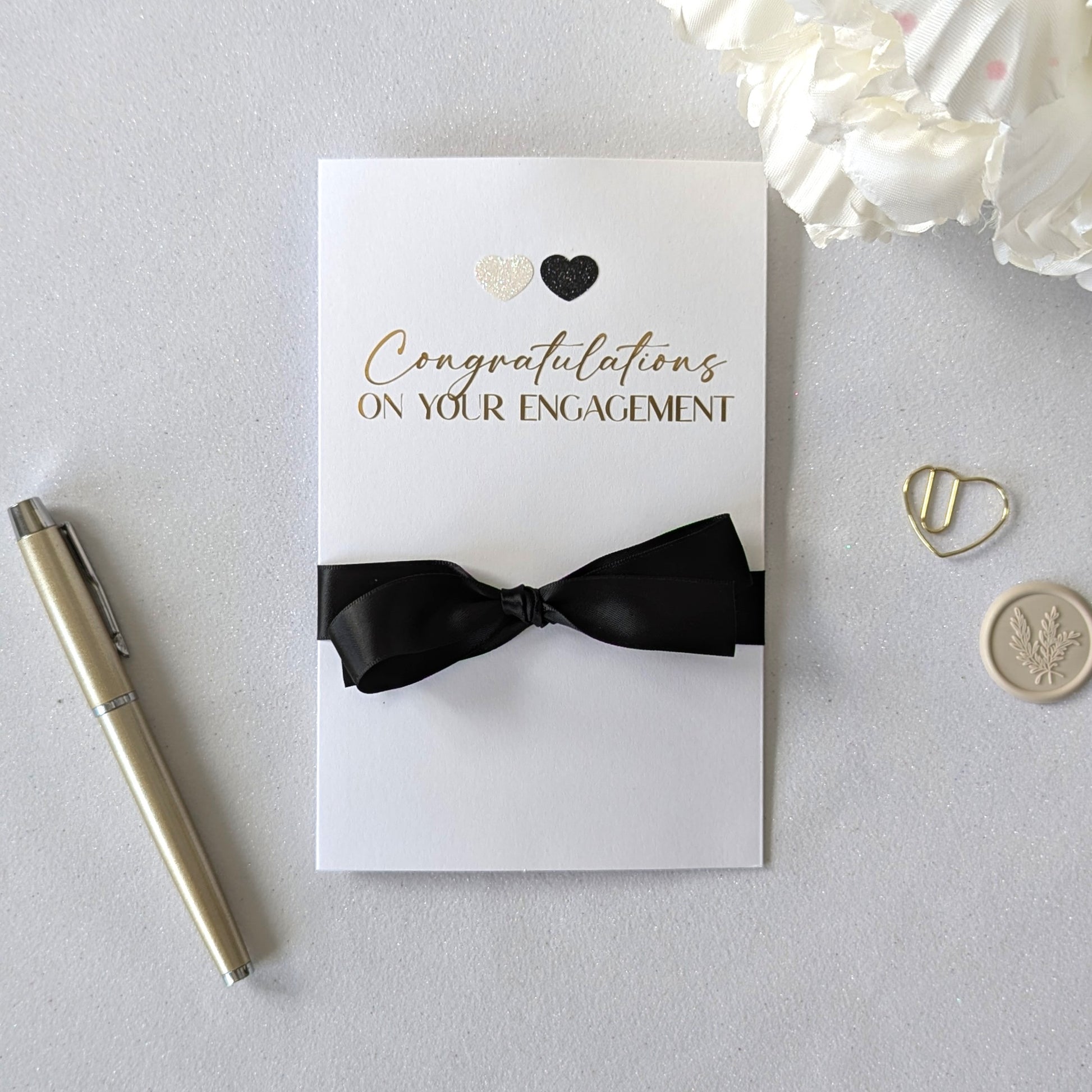 Congratulations on your engagement gift envelope with black and white glitter hearts and black satin ribbon