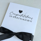 Congratulations on your engagement greeting card printed in black and white with black satin ribbon with black and white hearts