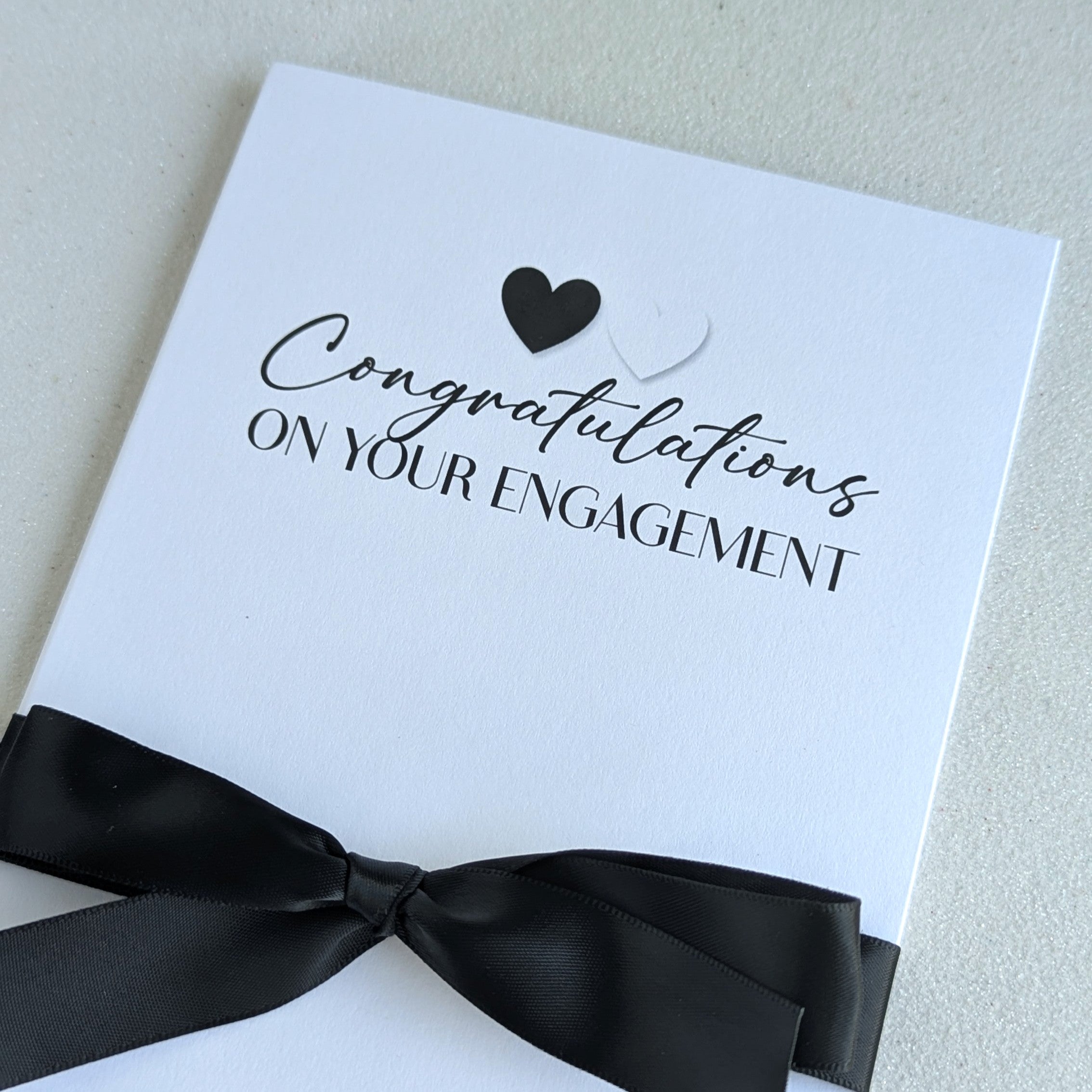 Congratulations on your engagement greeting card printed in black and white with black satin ribbon with black and white hearts