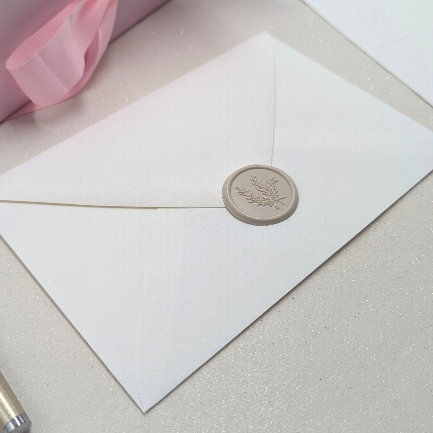 18 letters for 18 years archive quality felt paper and pigment ink. close up of wax sealed envelope