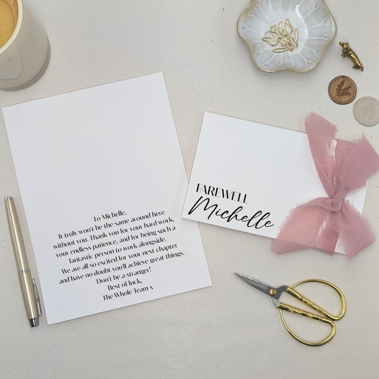 Luxury personalised farewell card with 'Farewell [Name]' printed on heavy-weight paper. Featuring a pink chiffon frayed-edge ribbon and a professional printed message inside in modern sans serif font.