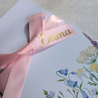 Floral Mothers Day card for gift voucher with personalised pink ribbon with Emma on it