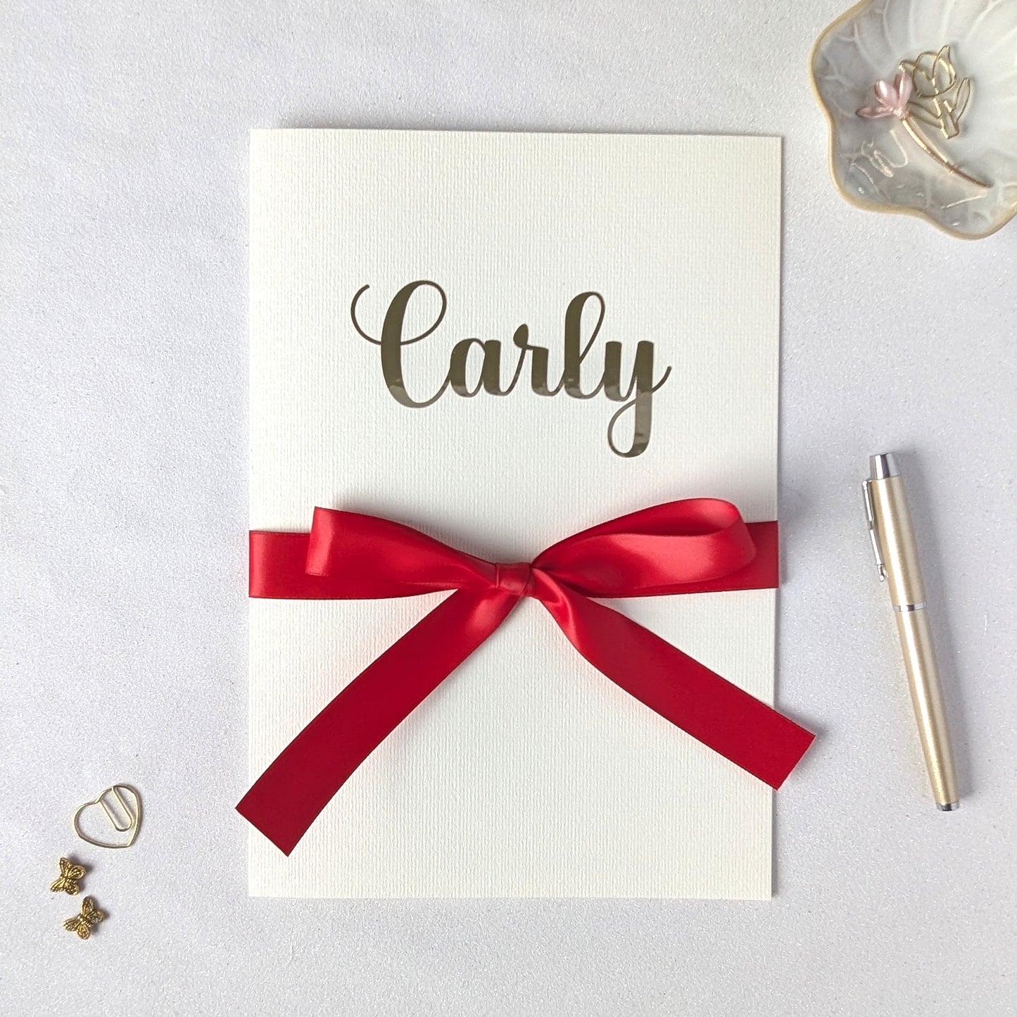 Large Personalised A4 greeting card with carly on the front and red satin ribbon