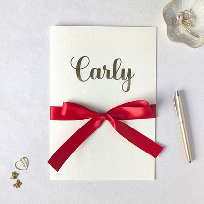 Large Personalised A4 greeting card with carly on the front and red satin ribbon