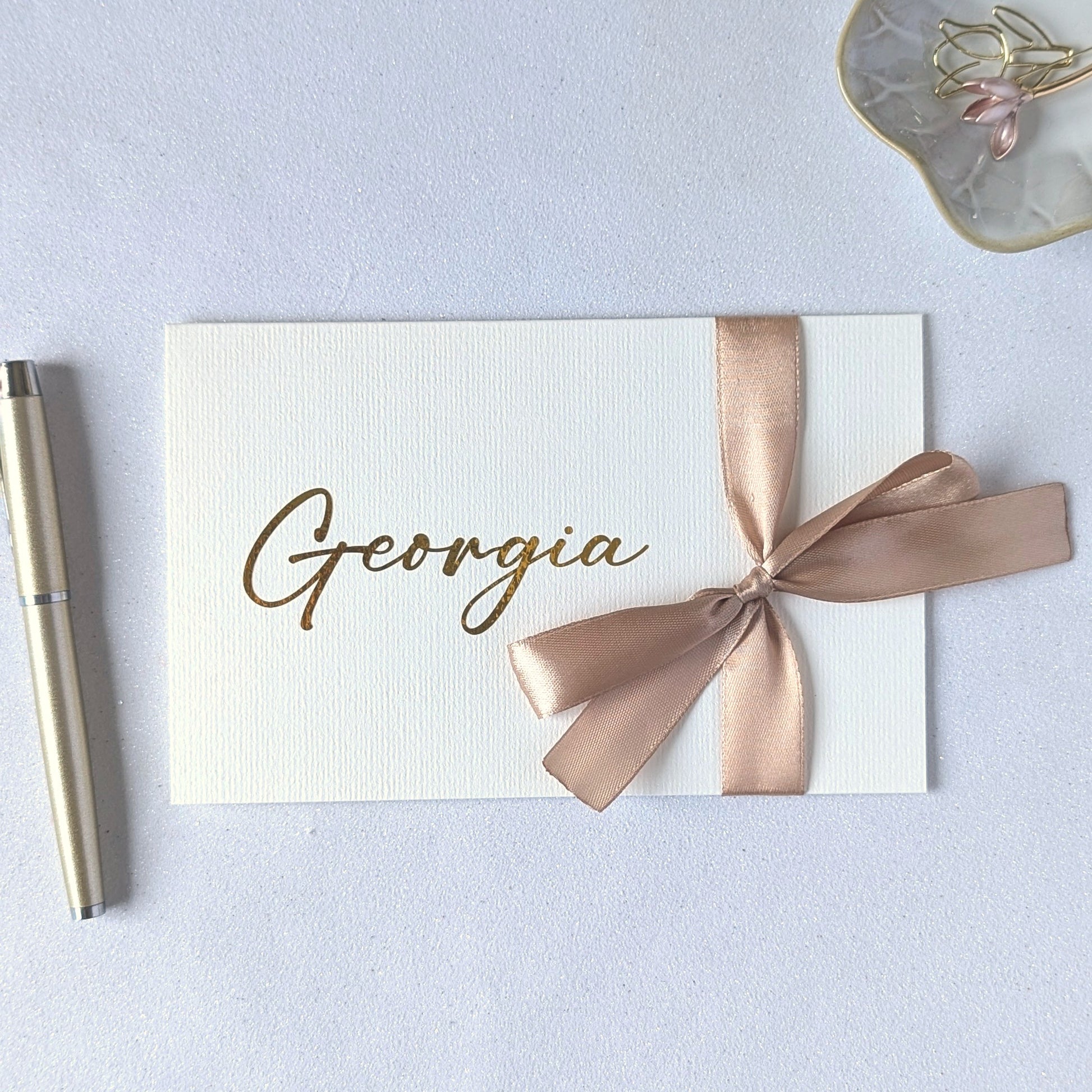 Love letter with gold writing and gold satin ribbon