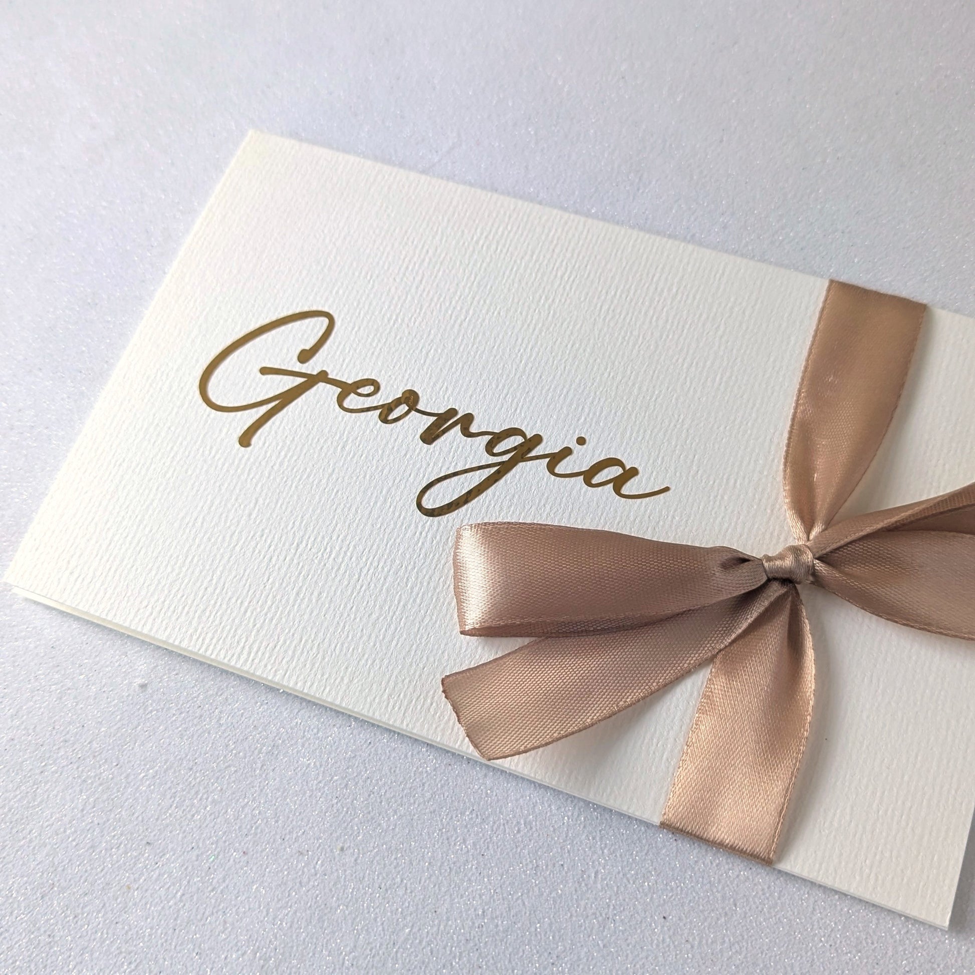 Love letter with gold writing and gold satin ribbon