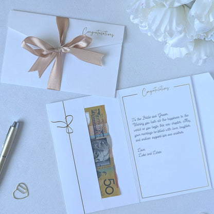 White wedding money gift envelope with gold satin ribbon