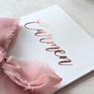 Close up of Beautiful Personalised birthday money envelope white card with Carmen in pink vinyl with pink ribbon
