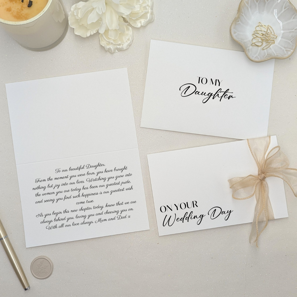 Luxury personalised wedding letter to daughter from parents featuring custom text and a gold organza ribbon. Shown with a heartfelt printed message inside in elegant script font and a matching custom envelope.