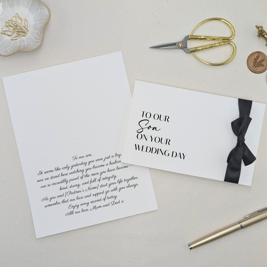 Personalised luxury wedding card for son with 'To My Son on Your Wedding Day' in black printed text. Finished with a black satin ribbon and a printed message inside in a clean modern sans serif font.
