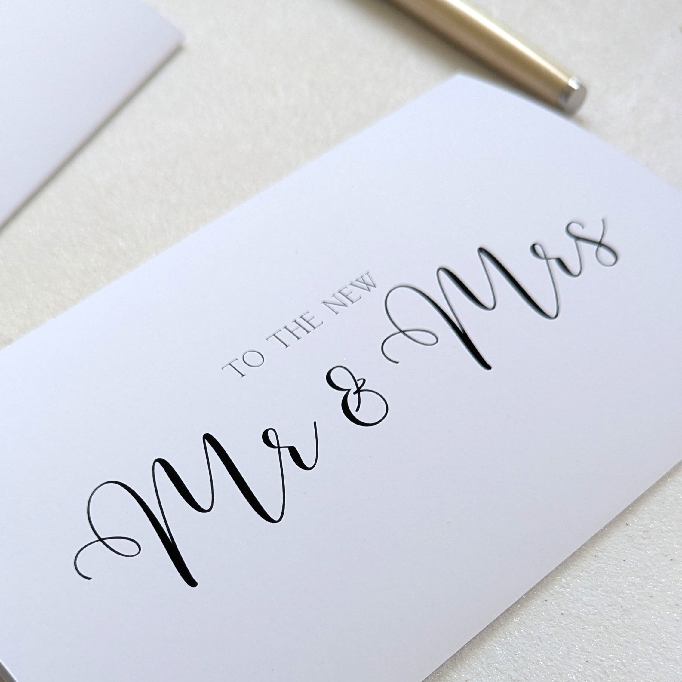 Close up of Wedding cash envelope with "To the new Mr & Mrs" printed on the front