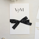 Close up of Wedding money gift card envelope with black satin ribbon