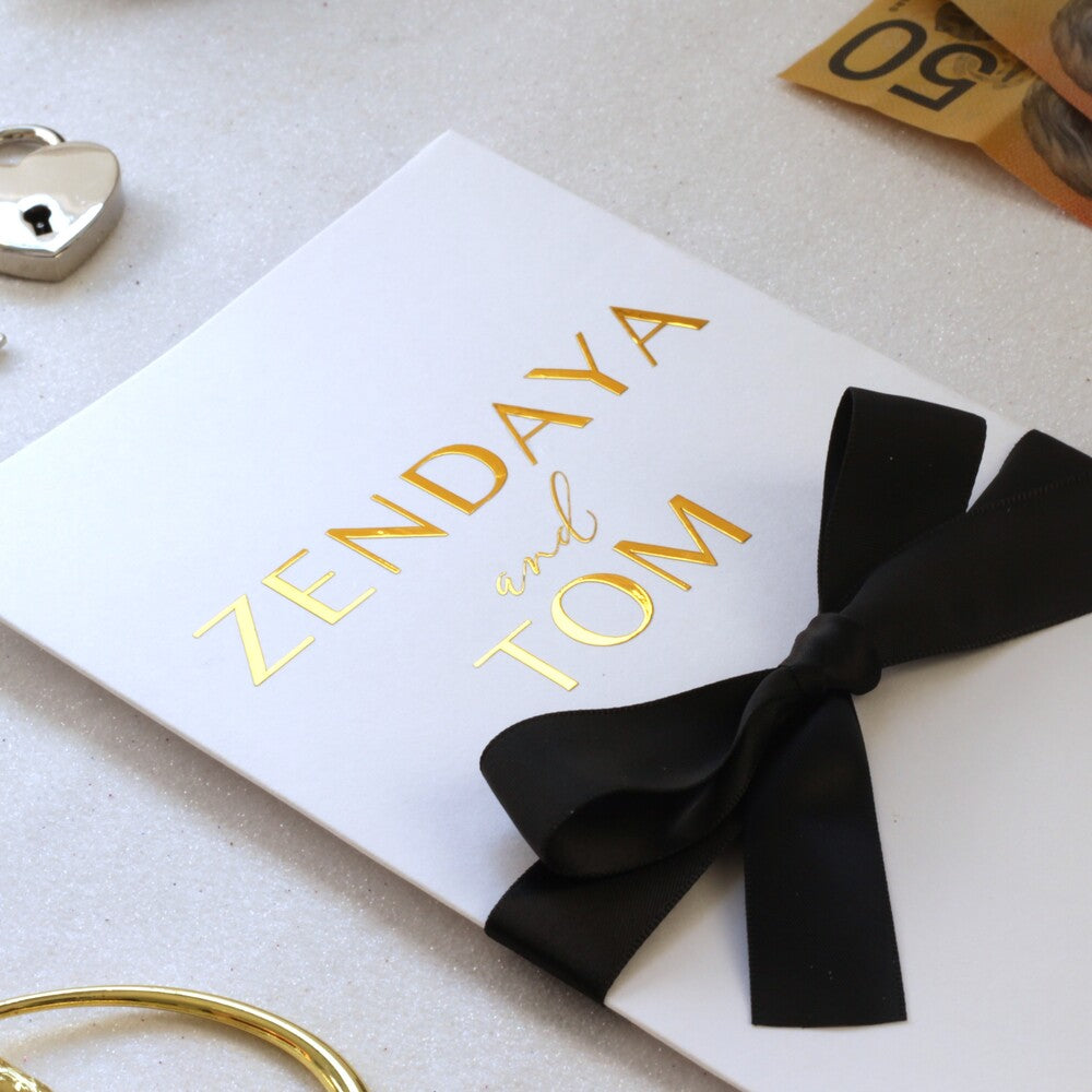 White wedding money card personalised gold foil names close up