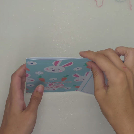 Demonstration of filling and ripping open the gift pocket for the money envelope