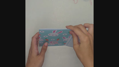 Demonstration of filling and ripping open the gift pocket for the money envelope