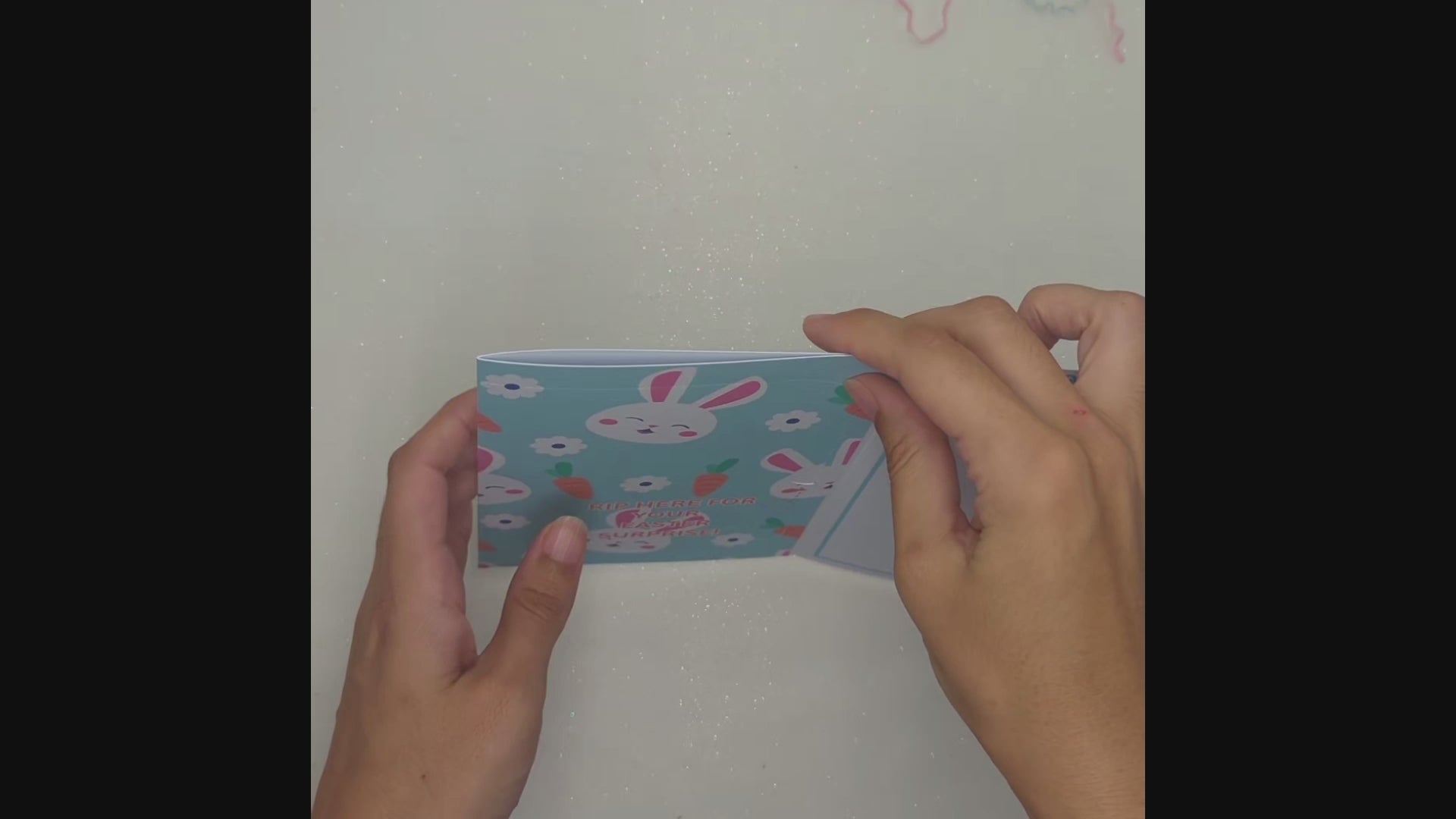 Demonstration of filling and ripping open the gift pocket for the money envelope